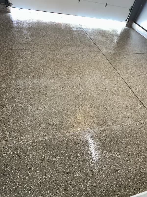 Close-up of a high-gloss sealed flake floor