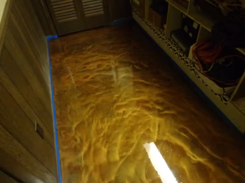 Pearl metallic epoxy floor in a residential space — subtle swirl pattern and high sheen