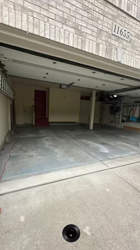 Bare concrete garage floor prepped and ready before Absolute installed the coating — job #11655