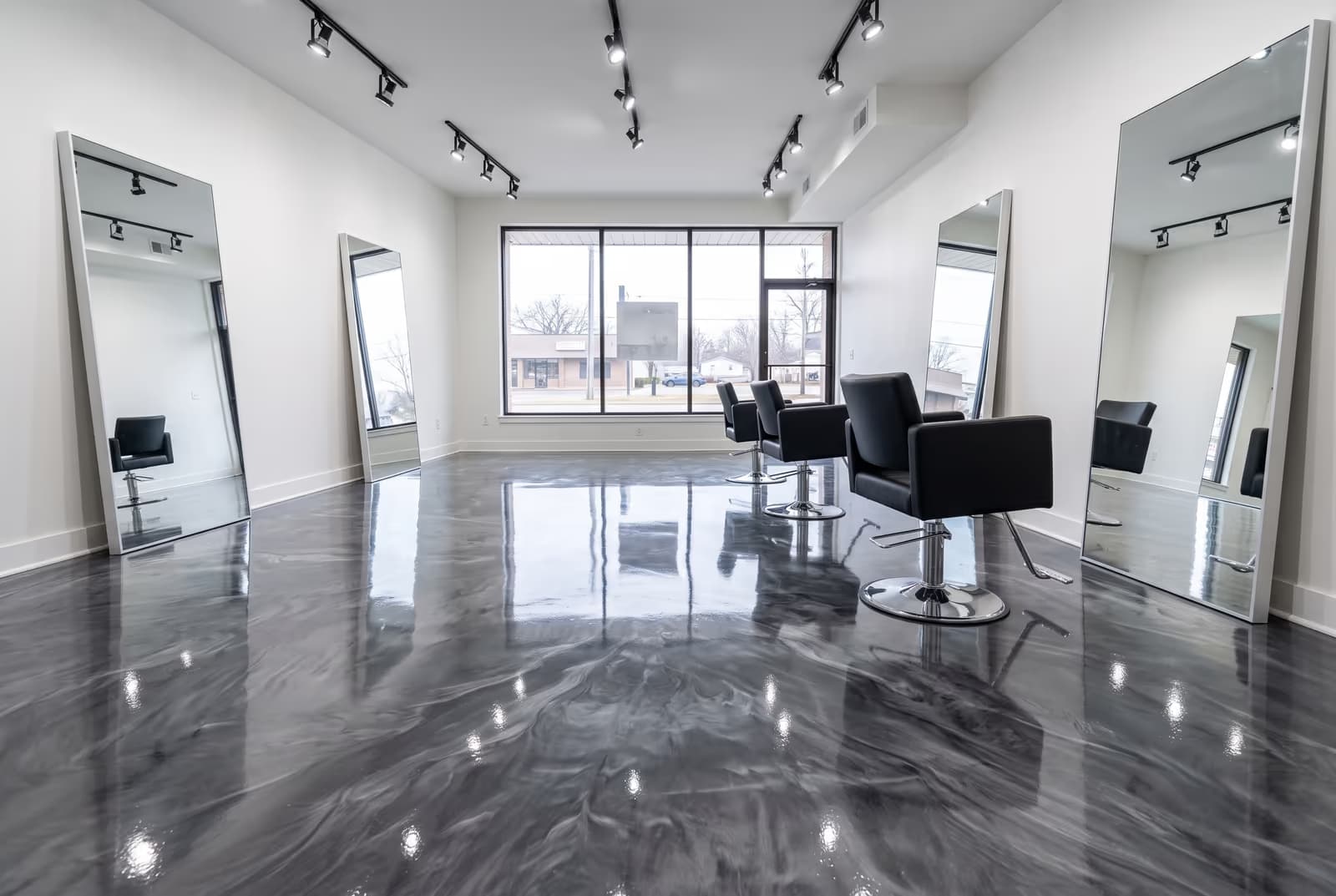 Charcoal and silver metallic epoxy floor in a salon